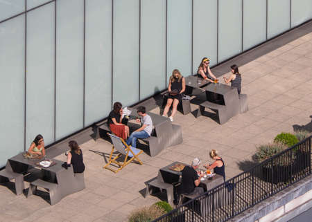 LONDON, UK - CIRCA SEPTEMBER 2019: People at Tate Modern art gallery roof bar in South Bank power...