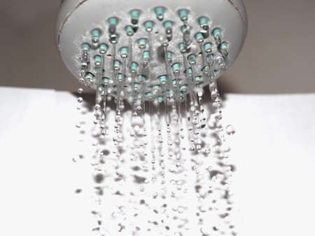 droplets of water flawing from a showerhead