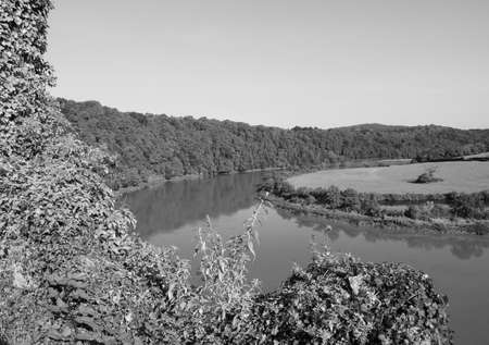 River Wye (Afon Gwy in Welsh) marks the border between England and Wales in Chepstow, UK in black and whiteの写真素材