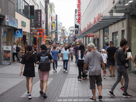 KOELN, GERMANY - CIRCA AUGUST 2019: People in Hohe Strasse (meaning High Street) shopping street