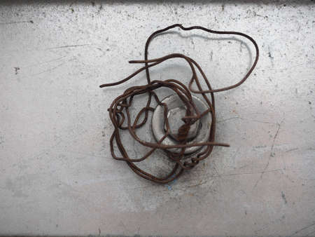 rusted iron wire and grey concrete backgroundの写真素材