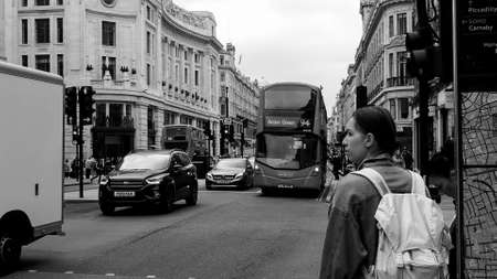 LONDON, UK - CIRCA SEPTEMBER 2019: Regent Street view with double decker bus in black and white