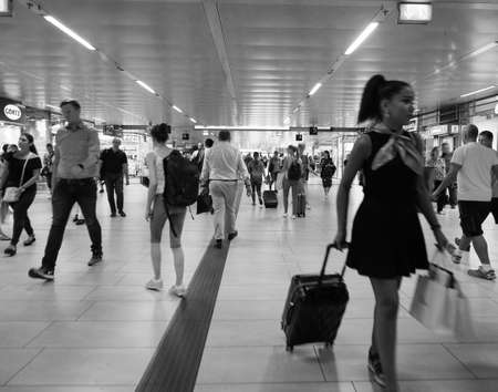 DUESSELDORF, GERMANY - CIRCA AUGUST 2019: Travellers in Duesseldorf Hauptbahnhof central station in black and whiteのeditorial素材