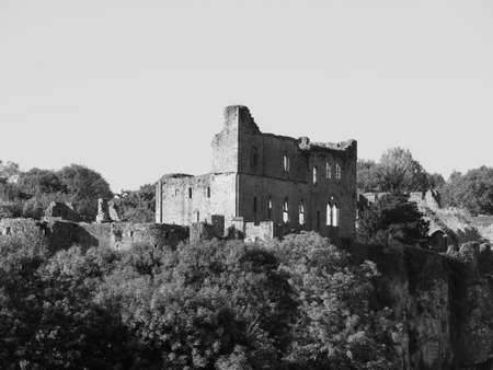 Ruins of Chepstow Castle (Castell Cas-gwent in Welsh) in Chepstow, UK in black and whiteのeditorial素材