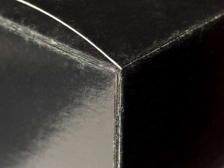 black box with light reflection and shades of grey