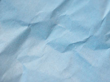 blue crinkled paper texture useful as a backgroundの写真素材