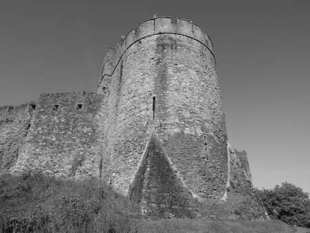 Ruins of Chepstow Castle (Castell Cas-gwent in Welsh) in Chepstow, UK in black and whiteの写真素材