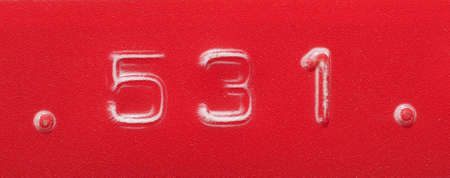 Number 531 label written with red plastic embossing tape
