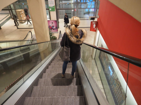 TURIN, ITALY - CIRCA FEBRUARY 2020: Woman on the escalatorのeditorial素材
