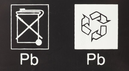 LONDON, UK - CIRCA JANUARY 2020: universal recycling symbol and Pb (Plumbum) symbol of Lead on a batteryのeditorial素材