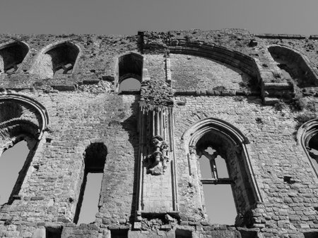 CHEPSTOW, UK - CIRCA SEPTEMBER 2019: Ruins of Chepstow Castle (Castell Cas-gwent in Welsh) in black...