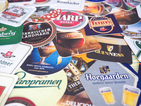 LONDON, UK - MARCH 10, 2020: Beer mats of many different brandsのeditorial素材