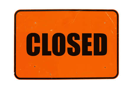 Closed sign a in shop window isolated over whiteの写真素材