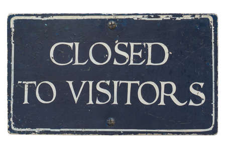 Closed to visitors sign isolated over white backgroundの写真素材