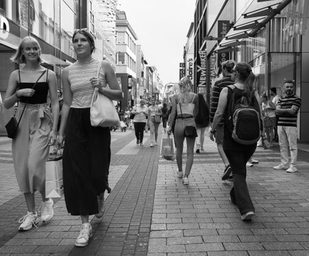 KOELN, GERMANY - CIRCA AUGUST 2019: People in Hohe Strasse (meaning High Street) shopping street in black and whiteのeditorial素材
