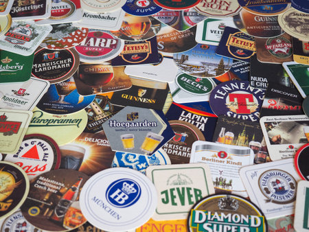LONDON, UK - MARCH 10, 2020: Beer mats of many different brandsのeditorial素材