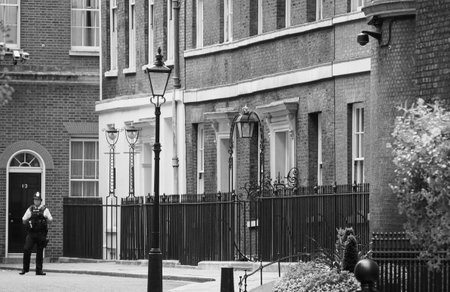 LONDON, UK - CIRCA SEPTEMBER 2019: Number 10 Downing Street headquarters of the Government and official residence of the Prime Minister of the United Kingdom in black and whiteのeditorial素材
