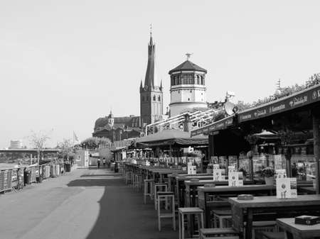 DUESSELDORF, GERMANY - CIRCA AUGUST 2019: Rheinuferpromenade on the bank of river Rhein in the Altstadt (old town) in black and whiteのeditorial素材