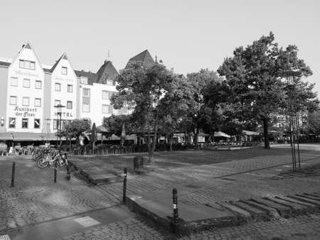 KOELN, GERMANY - CIRCA AUGUST 2019: Alter Markt (old market) historic square in the Altstadt (old town) is now the centre of night life with pubs and bars in black and whiteのeditorial素材