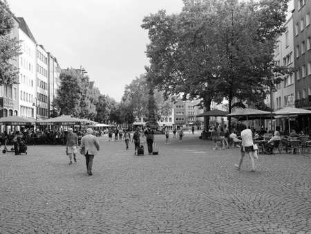 KOELN, GERMANY - CIRCA AUGUST 2019: Alter Markt (old market) historic square in the Altstadt (old town) is now the centre of night life with pubs and bars in black and whiteのeditorial素材