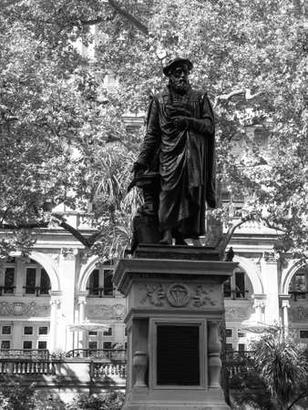 LONDON, UK - CIRCA SEPTEMBER 2019: Statue of William Tyndale martyr, first translator of the New Testament into English from the Greek in black and whiteのeditorial素材