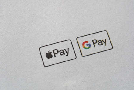 PALO ALTO, USA - CIRCA APRIL 2021: Google Pay and Apple Pay signs on a leaflet