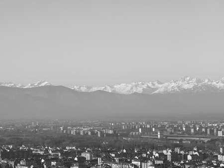 Aerial view of the city of Turin, Italy with Alps mountain range in the background in black and whiteの写真素材