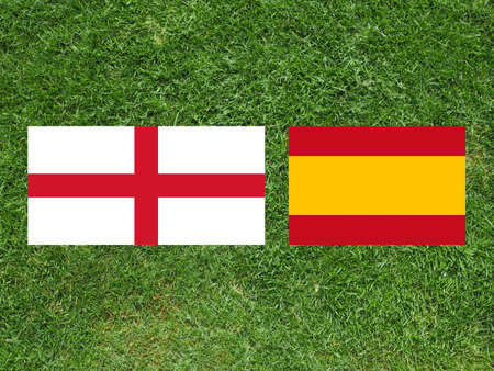 Flags of England and Spain over football fieldの写真素材
