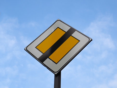 End of priority right of way road signの写真素材