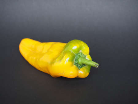 yellow peppers (scientific name Capsicum aka bell peppers) vegetables vegetarian foodの写真素材