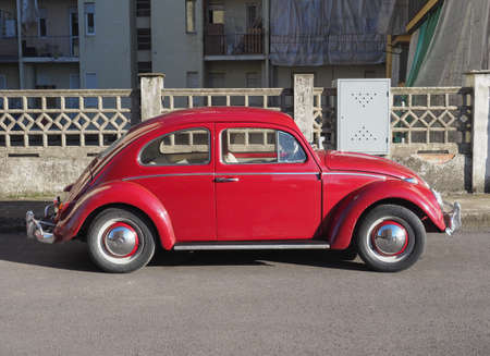 TOWN, COUNTRY - CIRCA DECEMBER 2021: red Volkswagen Beetle car