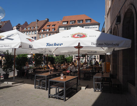 NUERNBERG, GERMANY - CIRCA JUNE 2022: People in the city centreのeditorial素材