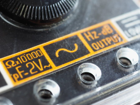 electrical symbols on a vintage analog multimeter measuring instrument
