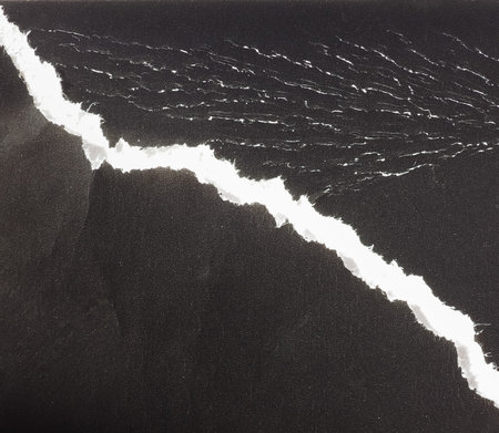 torn black paper texture useful as a backgroundの写真素材