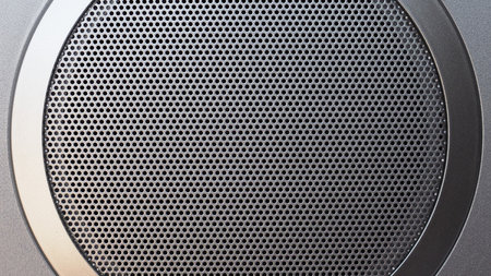 grey metal speaker grill texture useful as backgroundの写真素材
