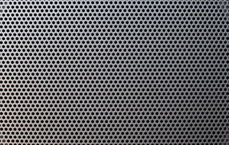 grey steel mesh metal texture useful as a backgroundの写真素材