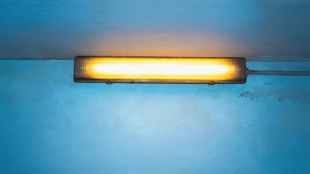 neon light lamp with copy space over wallの写真素材