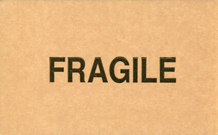 fragile sign on brown corrugated cardboard boxの写真素材