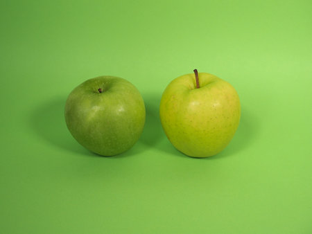 granny smith and golden delicious green applesの写真素材