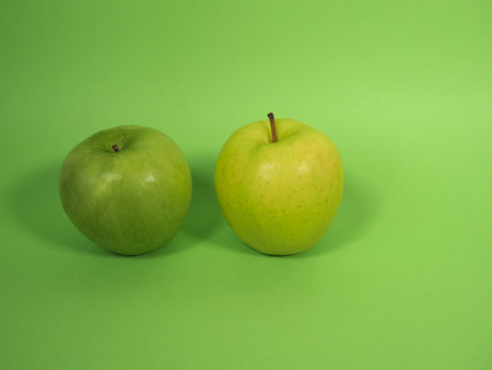 granny smith and golden delicious green applesの写真素材