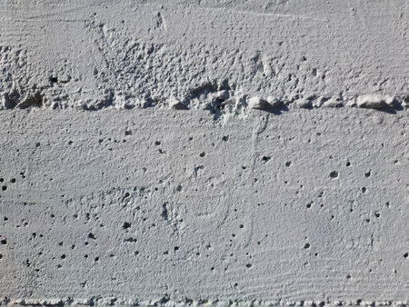 weathered grey concrete wall useful as a backgroundの写真素材