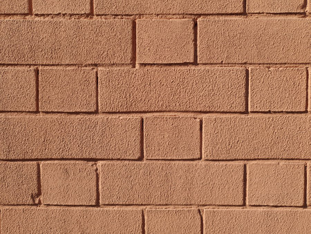 painted red brick wall useful as a backgroundの写真素材