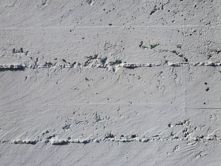 weathered grey concrete wall useful as a backgroundの写真素材