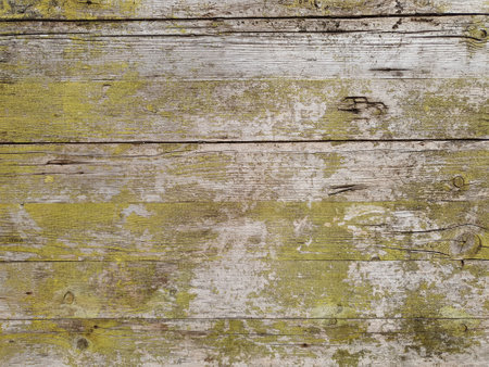 weathered yellow wood texture useful as a backgroundの写真素材