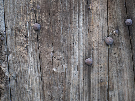 old weathered dark brown wood texture useful as a backgroundの写真素材
