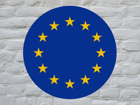 round flag of the European Union aka Europe over white bricks wallの写真素材