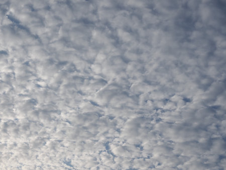 dramatic overcast stormy sky cloudscape with white clouds useful as a backgroundの写真素材