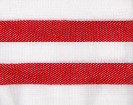 striped red and white cotton fabric texture useful as a backgroundの写真素材