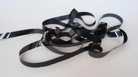 tangled magnetic tape from a vhs video tapeの写真素材