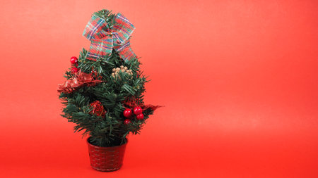 christmas tree over red background with copy spaceの写真素材